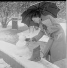 Woman making snowman